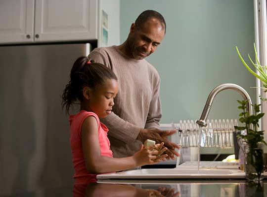 Black father and toddler son